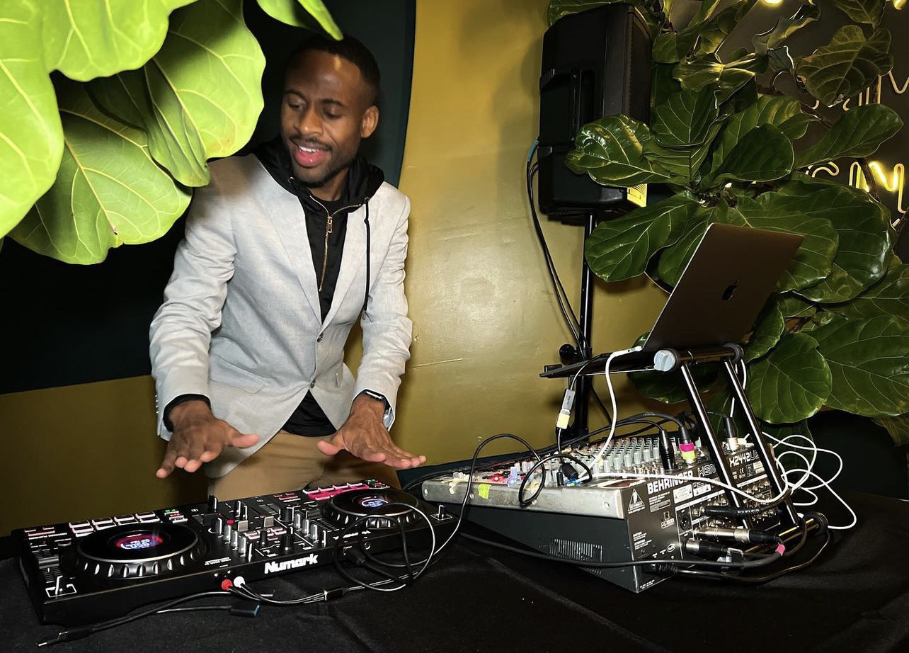 J Pierson working a DJ and audio setup